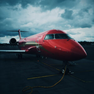 Red jet in airport 