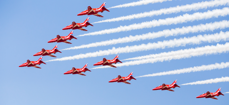 Red Arrows fighter jets flying in formation at the RIAT Royal International Air Tattoo.