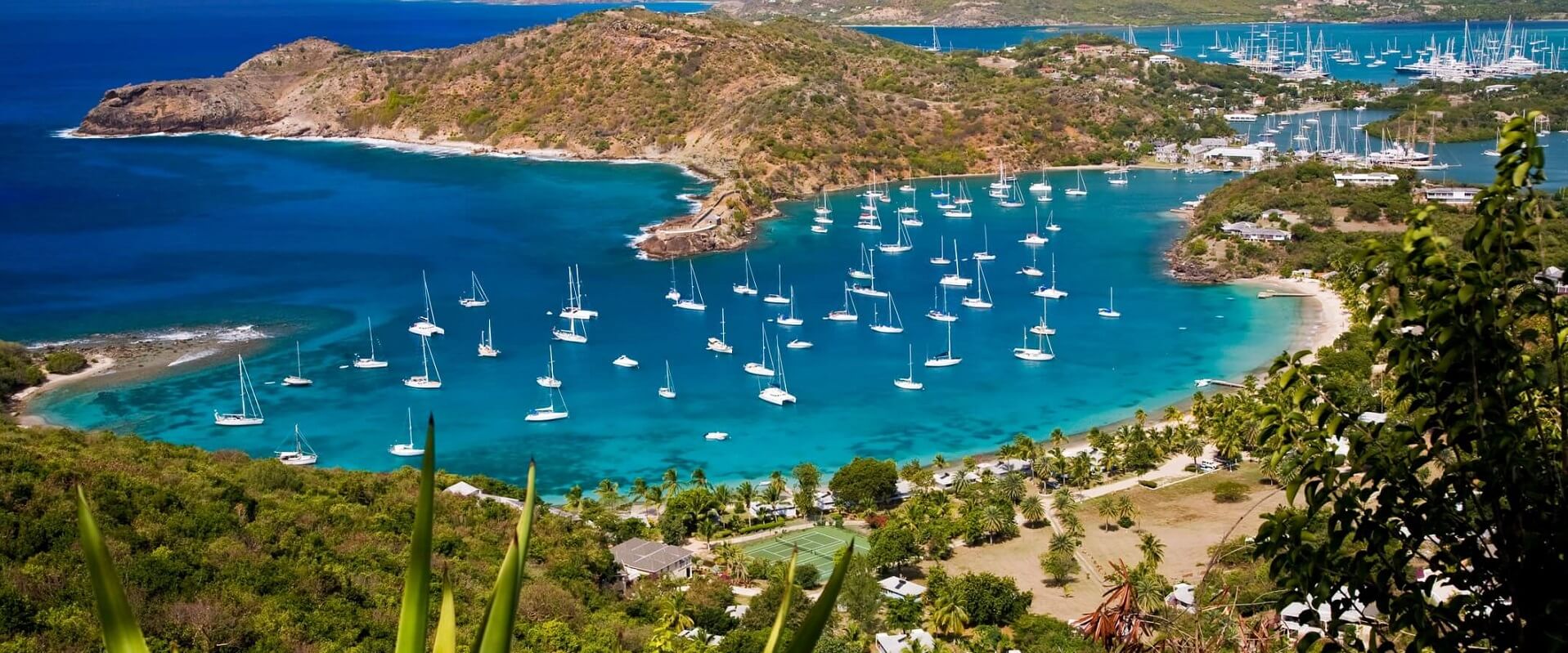 Dozens of luxury yachts anchored in two harbors during the Antigua Charter Yacht Show.