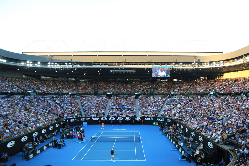 Tennis match in a full stadium at the Australian Open.