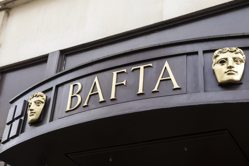 Awning that says BAFTA flanked by its iconic masks outside the BAFTA Awards.