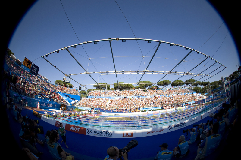 Fisheye view of swimming pool and stadium filled with fans at the FINA World Aquatics Championships.