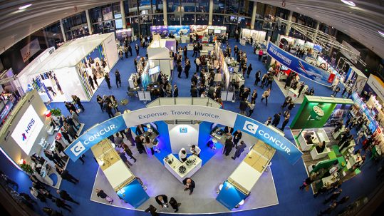 Fisheye skyview of attendees and kiosks at the GBTA Europe Conference.
