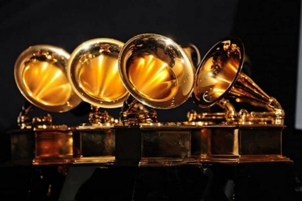 Five golden gramophone statuettes at the Grammy Awards.