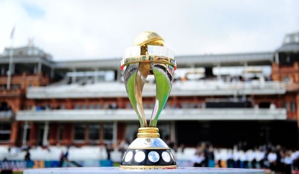 ICC Women's Cricket World Cup trophy in the foreground of a stadium.