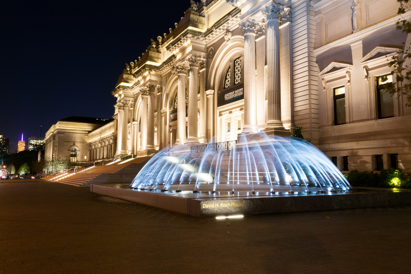 Fountain in front of the Metropolitan Museum of Art at night during the Met Gala.