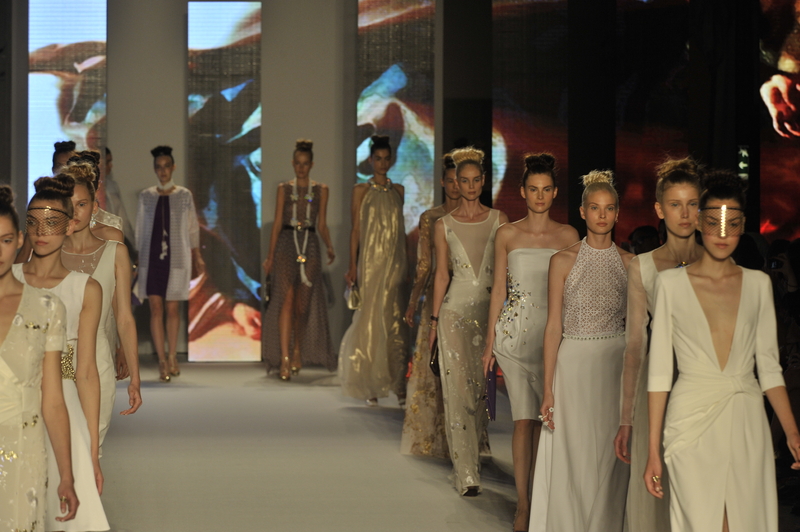 Twelve female models walking the runway at Milan Fashion Week.