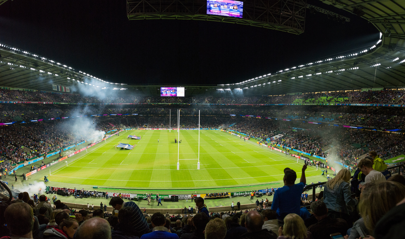 Stadium and field lit up for a night game at the Rugby World Cup.