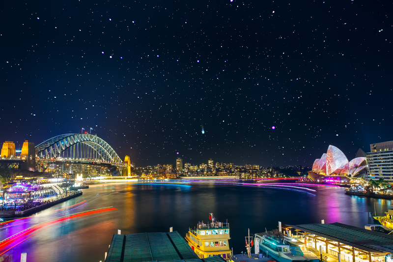 Sydney Opera House and other buildings around the bay with decorated with bright colored lights during Vivid Sydney,