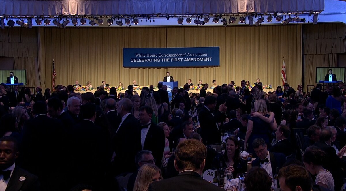 Presenter speaking to the audience at the White House Correspondents Dinner.