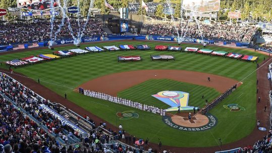 Fireworks and international flags in the outfield of the baseball stadium prior to the World Baseball Classic.