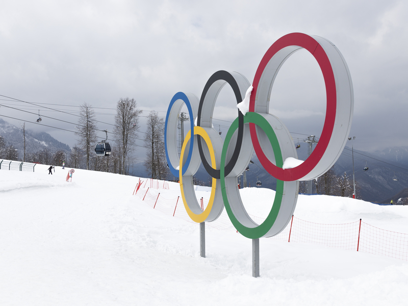 A statue of the Olympic rings on a snow-covered mountain at the Winter Olympic Games.