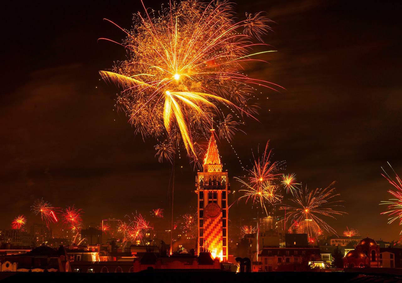 Bright orange fireworks over New York City for Holiday Travel Ideas.
