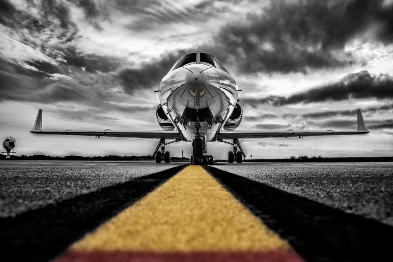 High contrast black and white photo parked private airplane waiting for passengers
