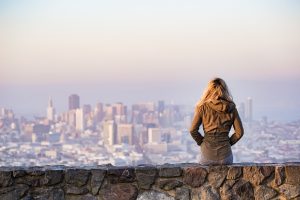 Blonde woman looking at the skyline during a San Francisco vacation.