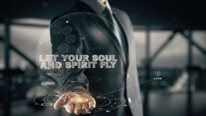 'Let Your Soul and Spirit Fly' quote with hologram businessman concept.