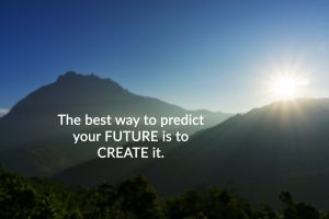 Inspirational and motivational future quote on blurry mountain background with sun peaking over - 'The best way to predict the future is to create it'