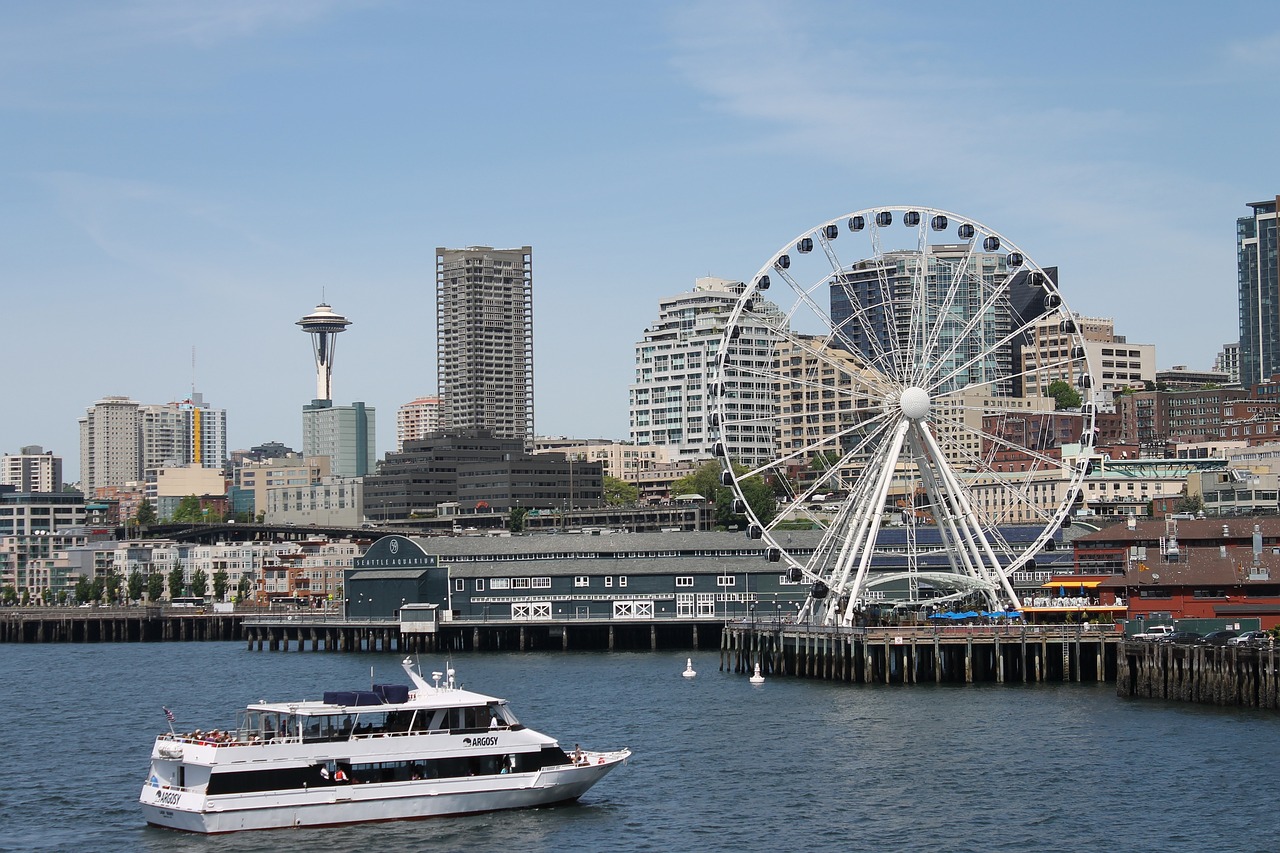 Seattle skyline with Space Needle and Large Ferris Wheel and Ferry Boat