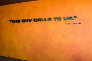 'The sky calls to us' space quote by Carl Sagan on the wall at NASA Kennedy Space Center in Cape Canaveral, Florida.