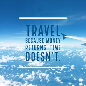 Inspirational quote 'Travel because money returns, time doesn't' on airplane wing with blue sky background.
